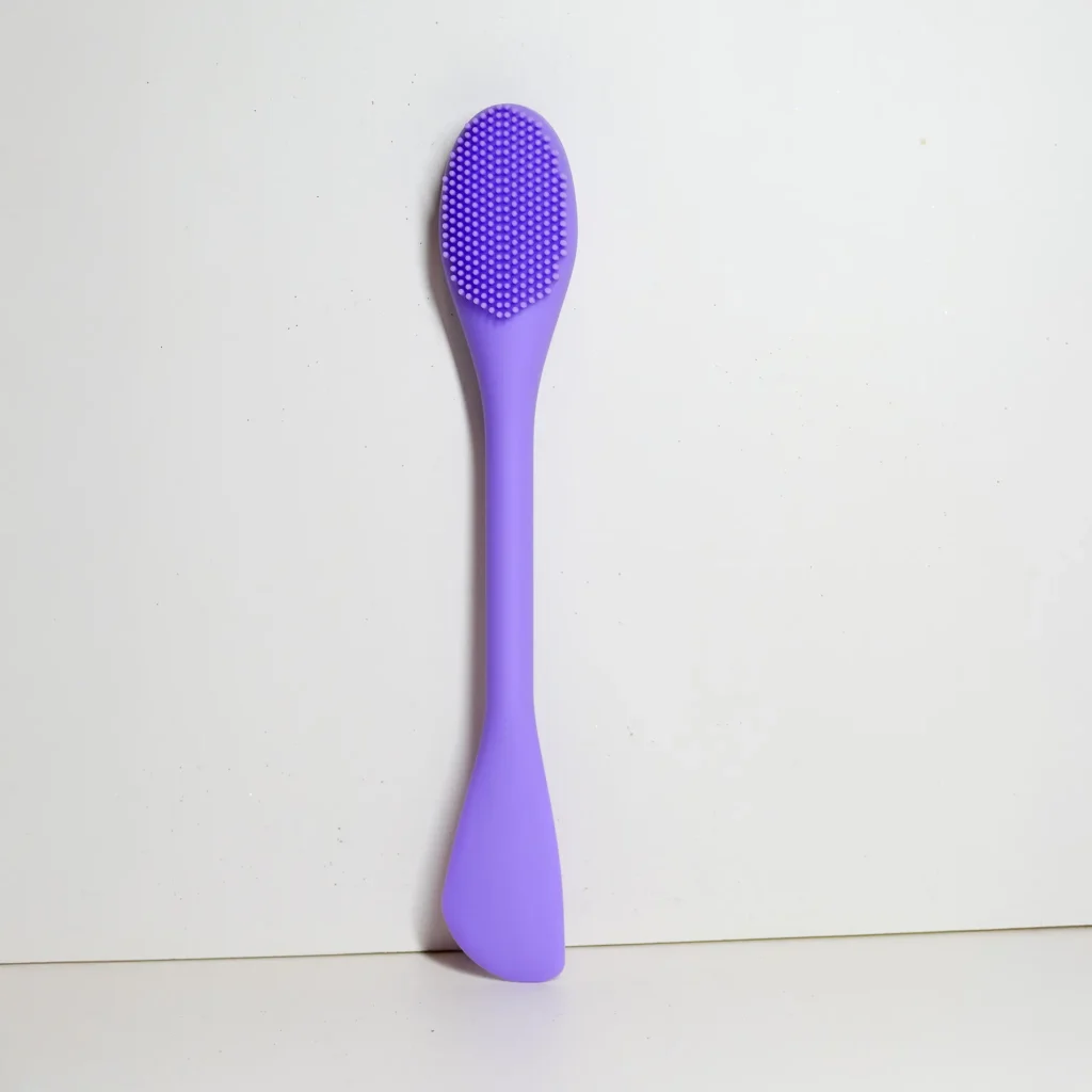 Facial scrub brush, angled view