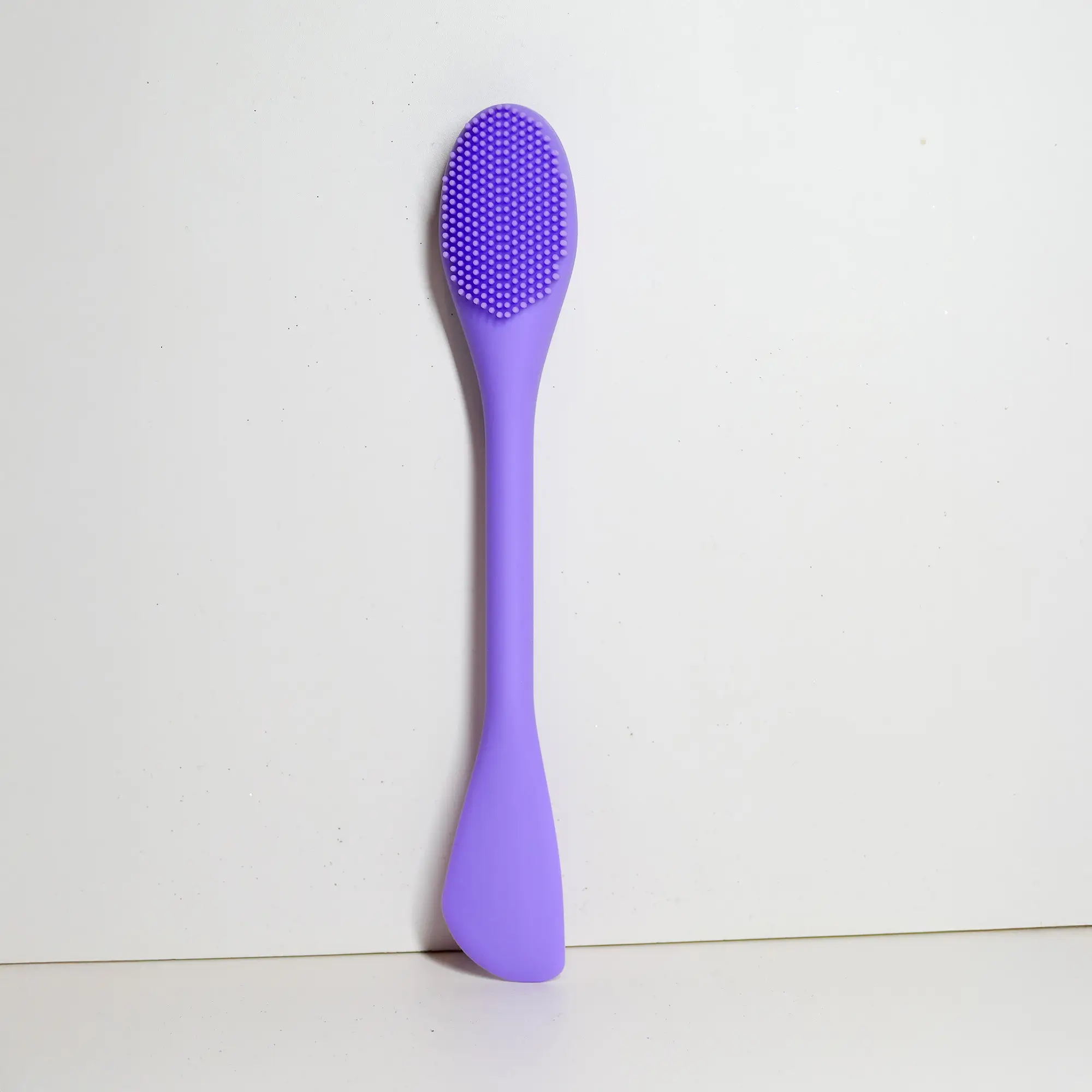 Facial scrub brush, angled view