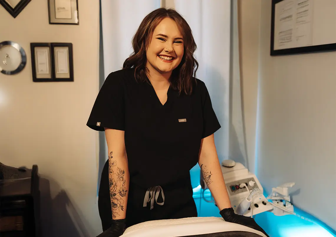 Aesthetician of the Month December 2025 Lauren Hybels posing in treatment room.